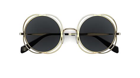 orla kiely gold frame glasses.